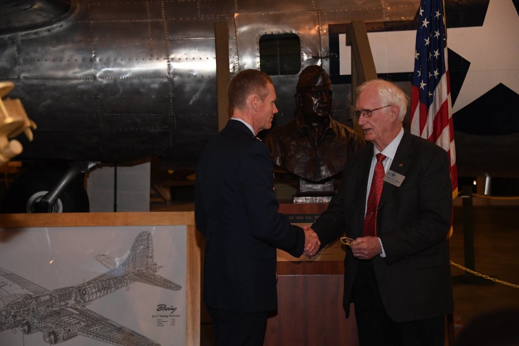 U.S. Air Force Maj. Gen James Dawkins, Jr., 8th Air Force and Joint-Global Strike Operations Center commander, presents retired Lt. Gen. E.G. "Buck" Shuler, a former 8th Air Force commander, an Eighth Air Force 75th anniversary coin and patch during the 28th Anniversary Reunion of Operation Secret Surprise at the National Mighty Eighth Museum in Savannah, Ga., Jan. 19, 2019. During World War II, under the leadership of such generals as Ira Eaker and Jimmy Doolittle, the 8th Air Force formed the greatest air armada in history. For this reason, 8th Air Force is commonly known as "The Mighty Eighth." (U.S. Air Force photo by Senior Airman Luke Hill)